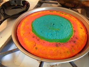 Pre-sliced rainbow cake. 